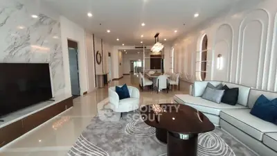 Luxurious modern living room with elegant decor and spacious layout.