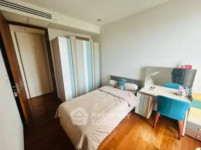 Cozy bedroom with modern furniture and wooden flooring