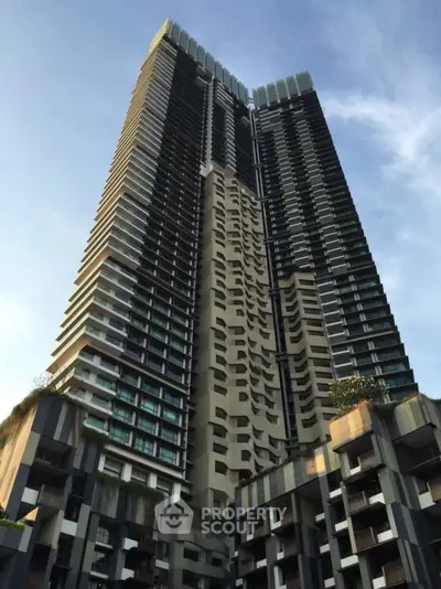 Stunning modern high-rise building with unique architectural design and lush greenery