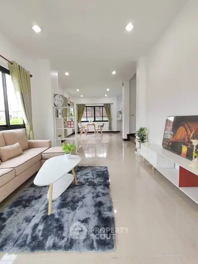 Spacious modern living room with stylish decor and natural light