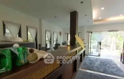Spacious living room with modern decor and large windows for natural light