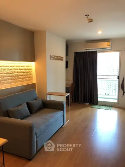 Modern living room with cozy sofa and balcony view in stylish apartment