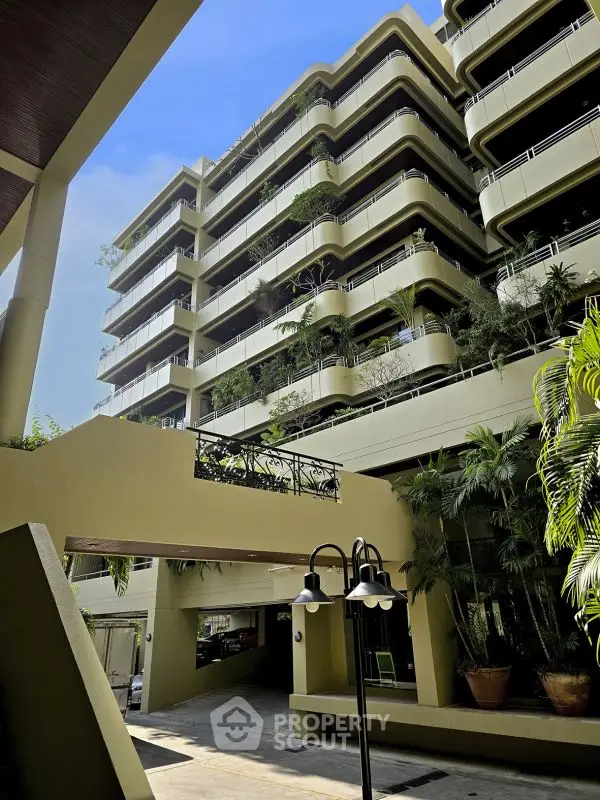 Modern architectural building with lush greenery and unique design elements
