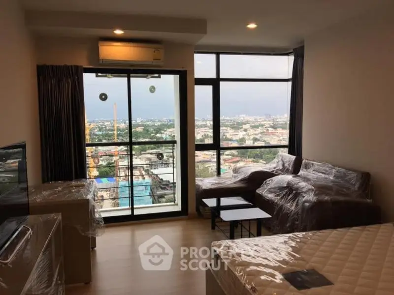 Modern living room with panoramic city view and stylish furnishings