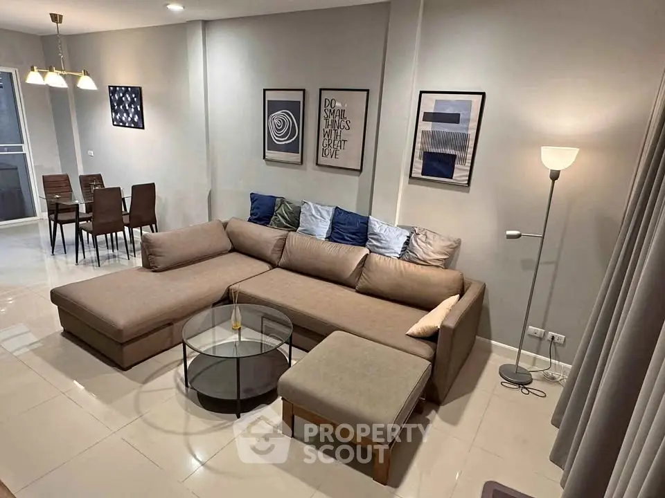 Modern living room with stylish decor and cozy sectional sofa in a contemporary apartment.
