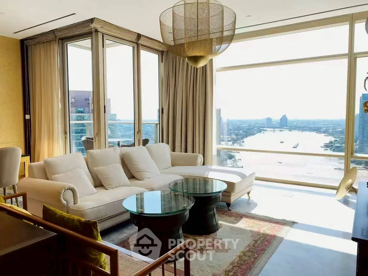 Luxurious living room with stunning river view and elegant furnishings