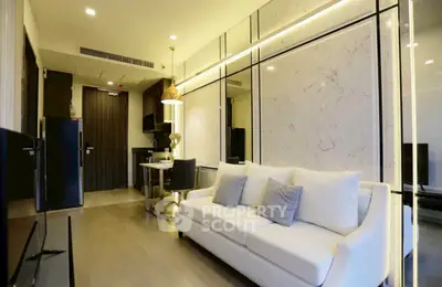 Modern living room with elegant decor and open kitchen layout