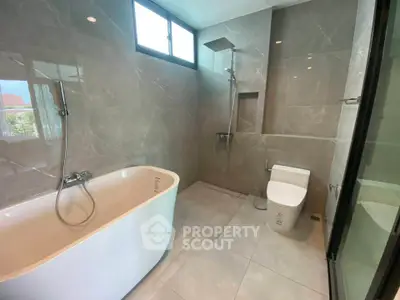 Luxurious modern bathroom with elegant bathtub and sleek shower design