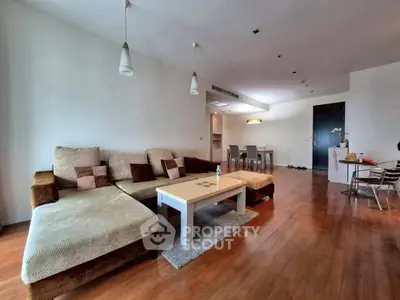 Spacious living room with modern furniture and wooden flooring