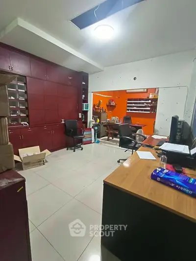 Spacious office space with modern furniture and ample storage, ideal for productivity and organization.