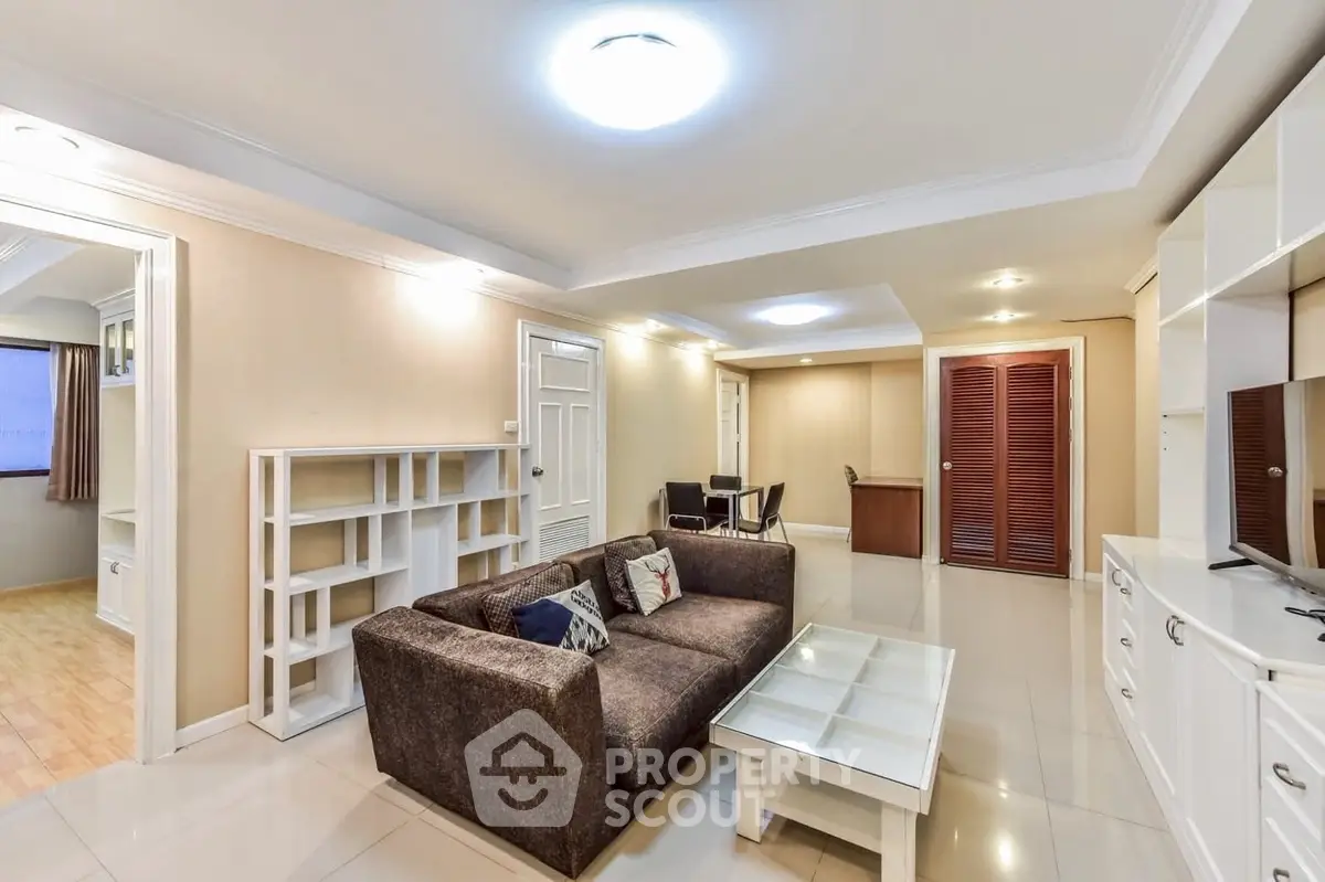 Spacious living room with modern furniture and bright lighting