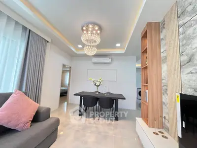 Modern living room with elegant chandelier and stylish decor