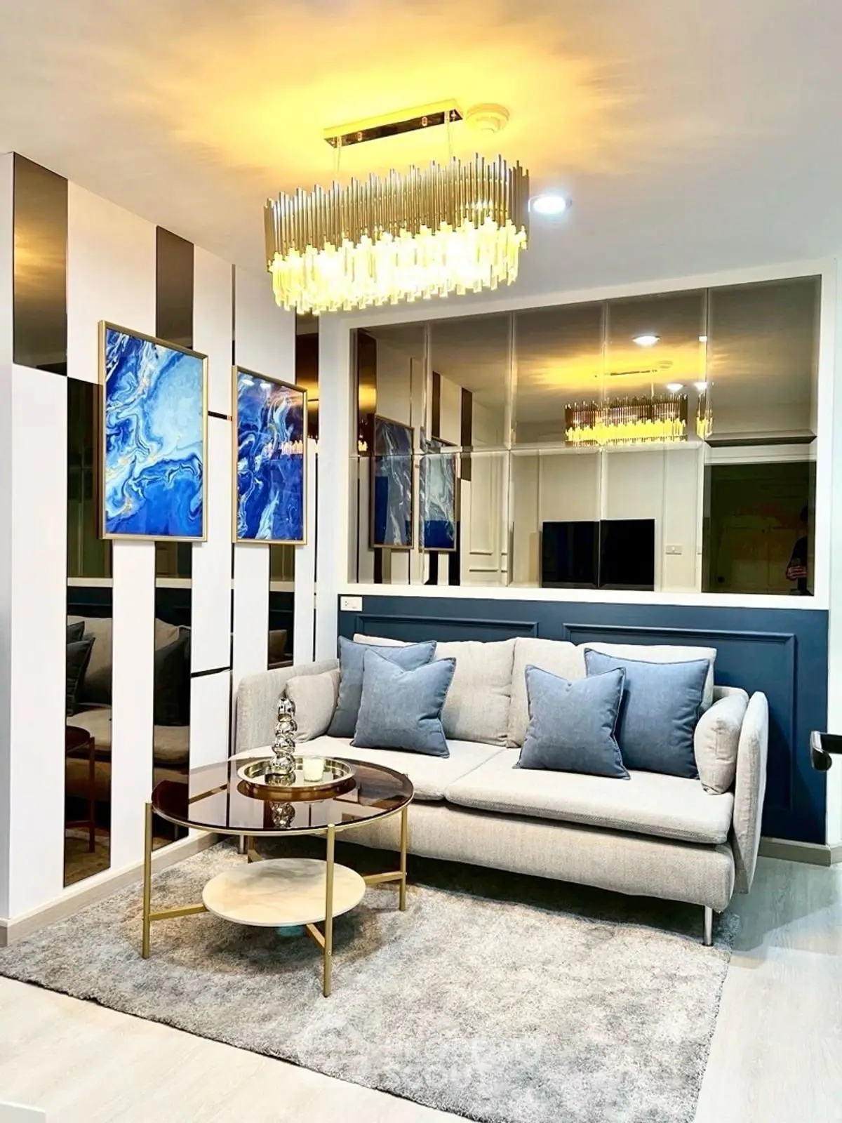 Luxurious living room with elegant chandelier and modern decor