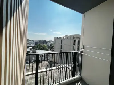 Spacious balcony with stunning city view in modern apartment