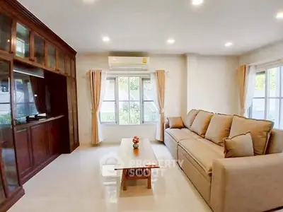 Spacious living room with cozy sofa and natural light