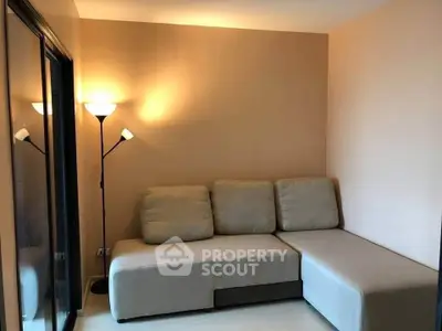 Cozy living room with modern sectional sofa and warm lighting