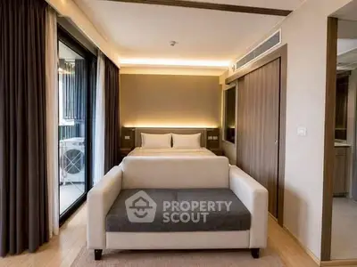 Modern bedroom with stylish decor and balcony view in luxury apartment