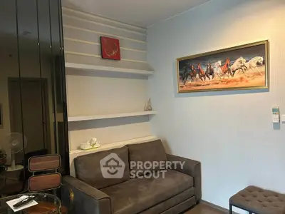 Cozy living room with modern decor and comfortable seating in a stylish apartment.