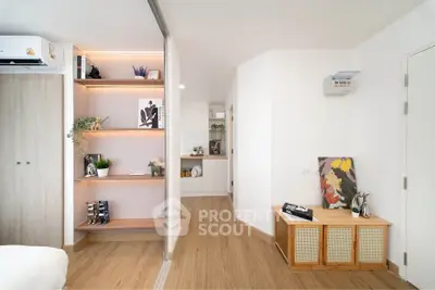 Modern interior with stylish shelving and wooden flooring in a cozy living space.