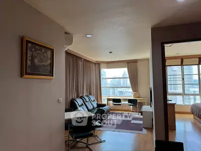 Spacious living room with city view and modern furnishings