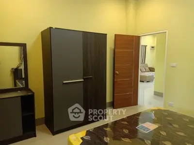 Spacious bedroom with modern wardrobe and cozy decor