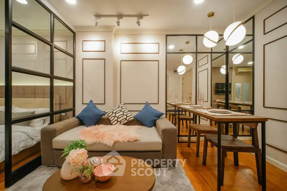 Chic modern living room with stylish decor and dining area, perfect for urban living.