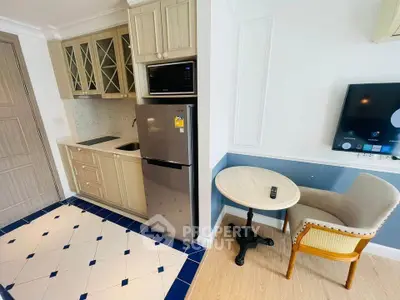Charming compact kitchen with modern appliances and cozy dining nook