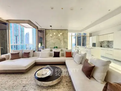 Luxurious modern living room with panoramic city views and elegant decor.
