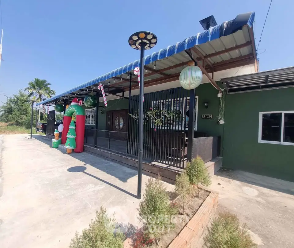 Charming single-story home with festive decorations and spacious outdoor area.