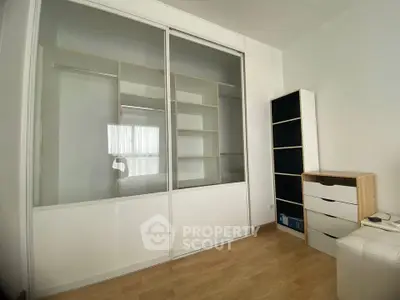 Spacious bedroom with built-in wardrobe and ample natural light