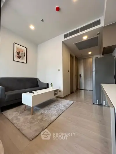 Modern living room with sleek furniture and stylish decor in a contemporary apartment.