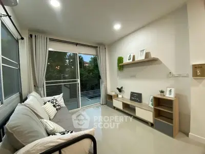 Modern living room with sleek design and balcony view