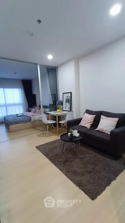 Modern open-plan living room with cozy seating and stylish decor