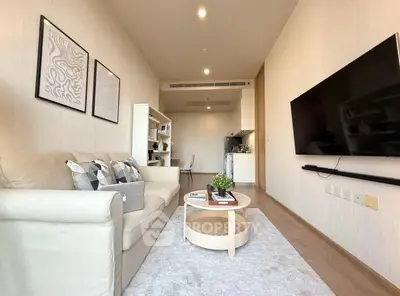 Modern living room with sleek design and open kitchen layout