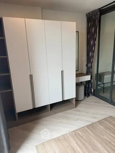 Modern bedroom with sleek wardrobe and stylish decor