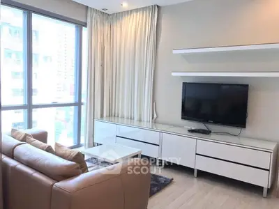 Modern living room with sleek furniture and large window view