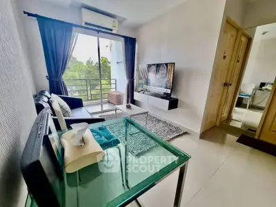 Modern living room with balcony view, sleek furniture, and large TV, perfect for urban living.