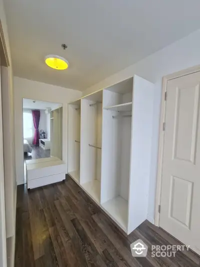 Spacious walk-in closet with modern design and ample storage space