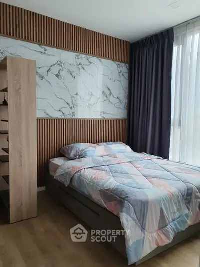 Modern bedroom with stylish decor and large window