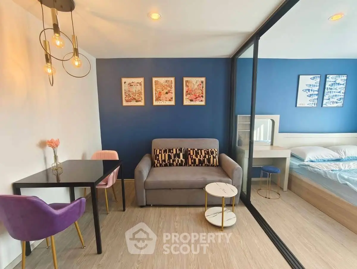 Modern studio apartment with stylish decor and cozy seating area