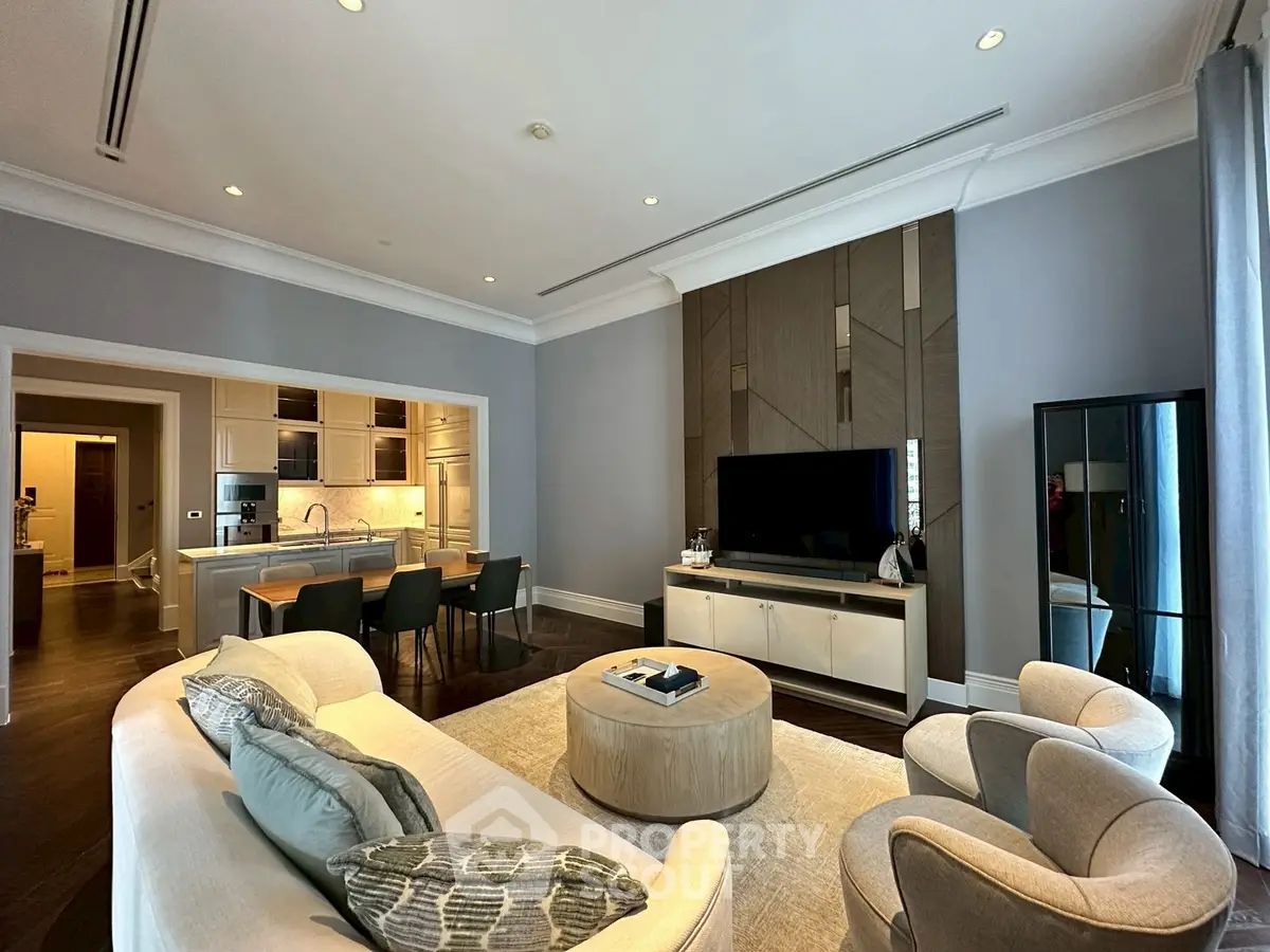 Luxurious open-concept living room with modern kitchen and elegant decor