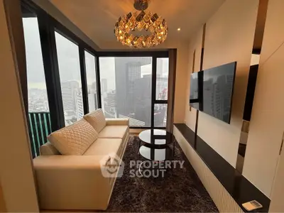 Luxurious high-rise living room with panoramic city views and elegant chandelier.