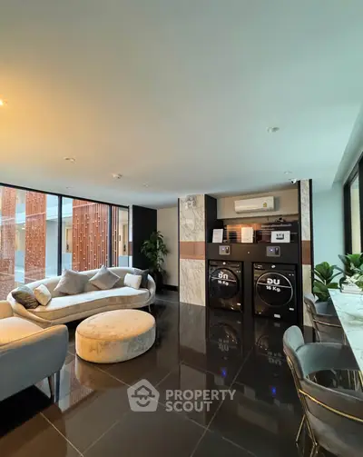 Luxurious living room with modern decor and in-unit laundry facilities