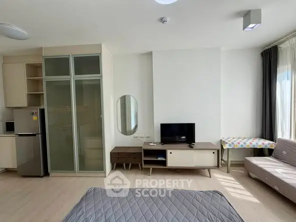 Modern studio apartment with sleek design and natural light