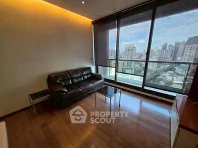 Modern living room with stunning city view and sleek leather sofa