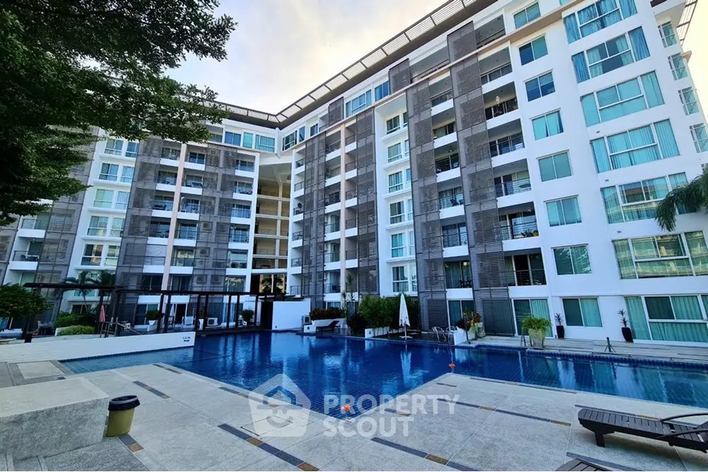 Modern condominium with pool and spacious outdoor area, perfect for luxury living.