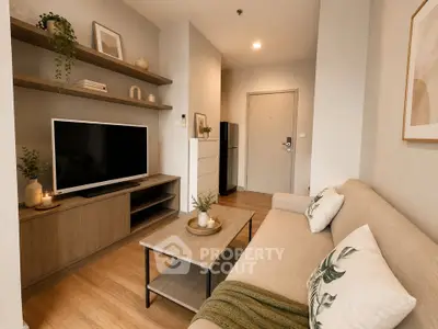 Modern living room with cozy sofa, stylish decor, and large TV in a contemporary apartment.