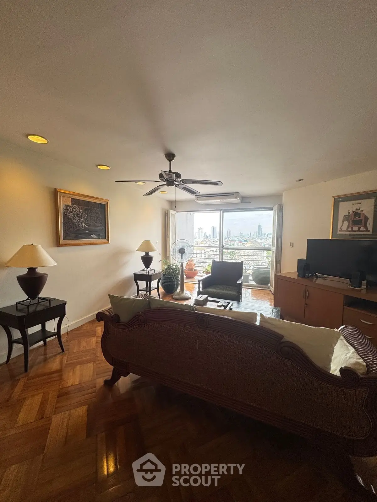 Spacious living room with elegant decor and stunning city view