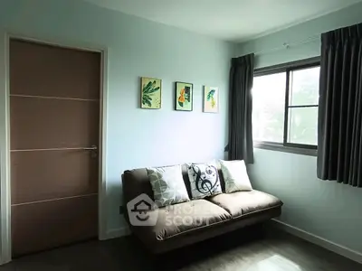 Cozy living room with modern sofa and stylish decor in a bright apartment.