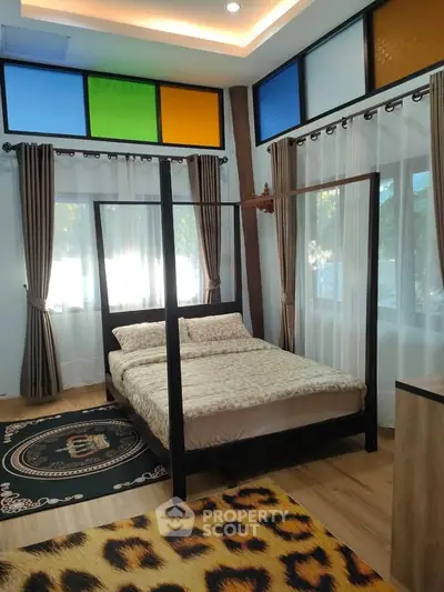 Stylish bedroom with colorful windows and modern decor